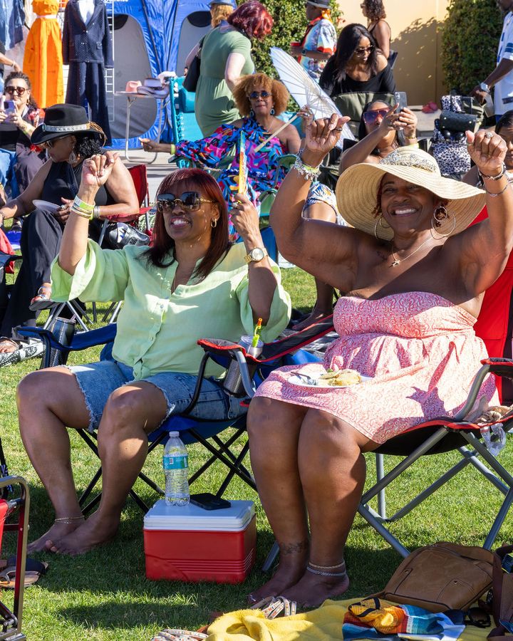 Guests settled into chairs on the lawn