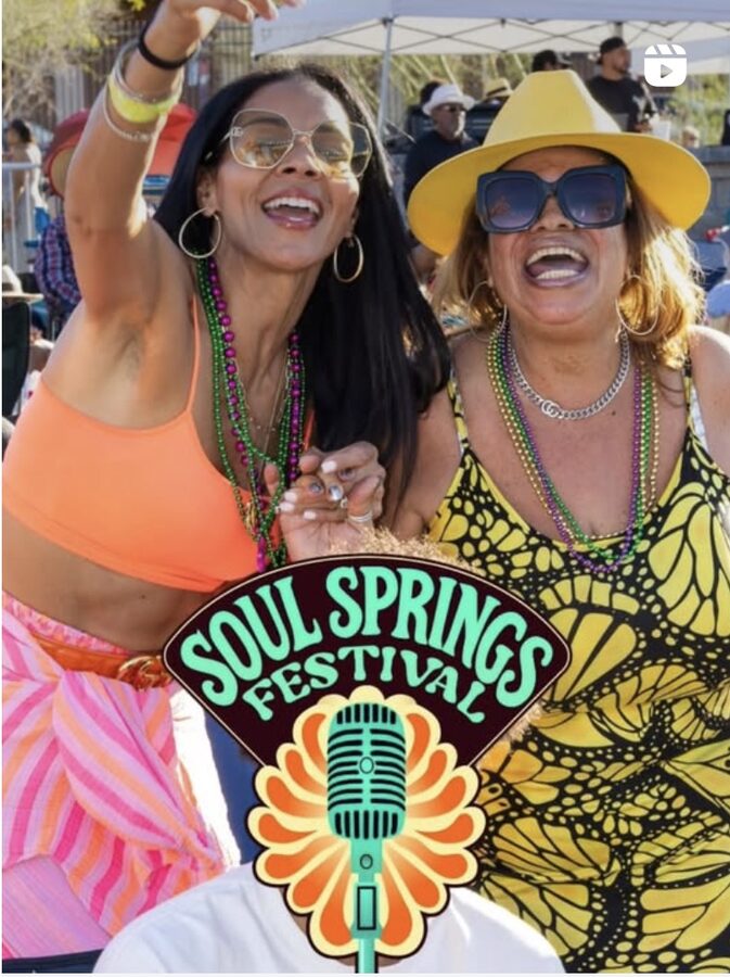 Two friends celebrating together at the festival
