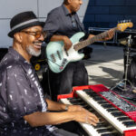 Musicians playing keyboard and bass guitar on stage at Soul Springs Festival