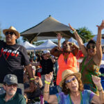 Crowd with hands raised dancing to the music at Soul Springs Festival