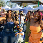 Three women singing along and dancing together at Soul Springs Festival
