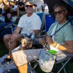 Friends relaxing with their dog in lawn chairs at Soul Springs Festival