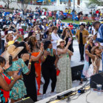 Fans gathered near the stage photographing the performer at Soul Springs Festival