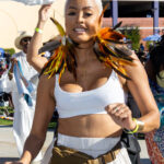 Dancer in feathered costume performing at Soul Springs Festival